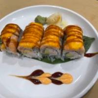 Salmon Lover Baked Roll · Inside: crab meat, avocado. Outside: salmon, spicy mayo and eel sauce.