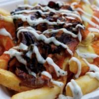 Rancharina Fries (GF) · Cajun French fries with melted cheeze sauce, caramelized onions, buffalo sauce and ranch dre...
