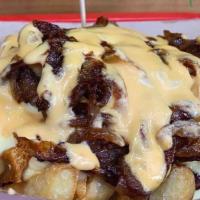 Animal Style Fries (GF) · Crispy fries seasoned to perfection, topped with cheeze sauce, caramelized onions and drizzl...