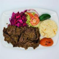 Lamb Gyro · Thinly sliced lamb gyro served with rice, house salad and red cabbage