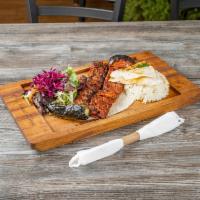 Adana Kebab · Char-grilled ground lamb seasoned with mixed spices served with rice
