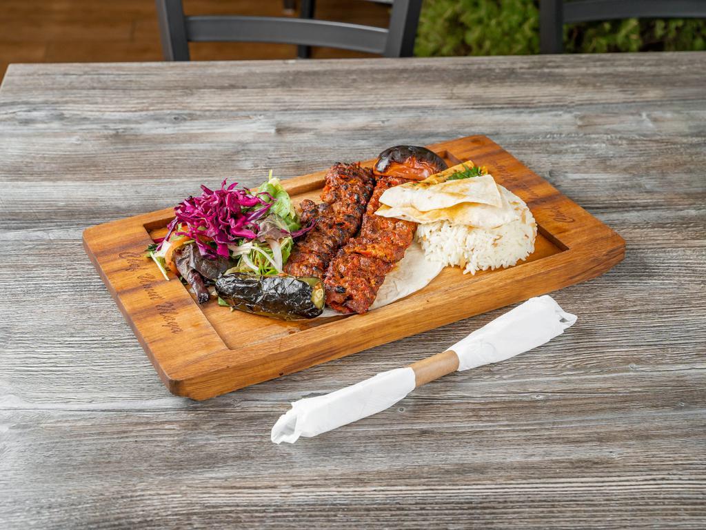 Adana Kebab · Char-grilled ground lamb seasoned with mixed spices served with rice
