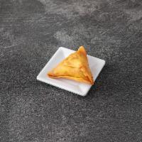 Chicken Samosa · Seasoned ground chicken wrapped in a light pastry.