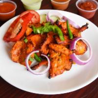 Chicken Tikka with Naan · Boneless chicken marinated in spies and roasted in clay oven.