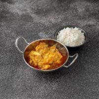 Chicken Curry · Chicken made with onion paste, garam masala and hot spices.