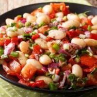 13. White Bean Salad · White beans mixed with red onions, parsley, tomatoes, fresh red pepper, olive oil and vinega...