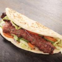 48. Lamb Adana Kebab Sandwich · Thinly sliced lamb gyro served with onions, lettuce and tomatoes.