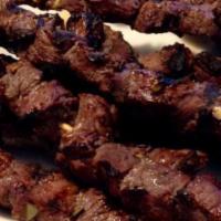 28. Beef Shish Kebab · Char-grilled marinated beef cubes; served with rice and salad.