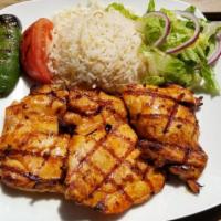 33. Chicken Chops · Char-grilled chicken thighs served with rice and salad.