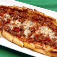 42. Chopped Meat Pita · A flat bread topped with chopped meat and spices.