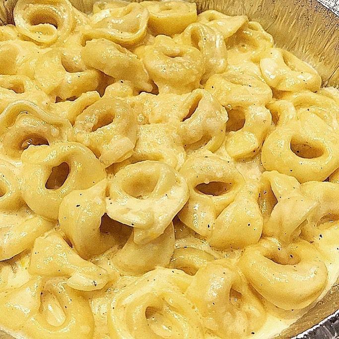 Tortellini Della Nonna · Cheese-filled pasta with peas and ham in a cream sauce.
