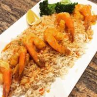 Shrimp Scampi · Tender shrimp sauteed in a garlic, butter, white wine and lemon served over a bed of rice.