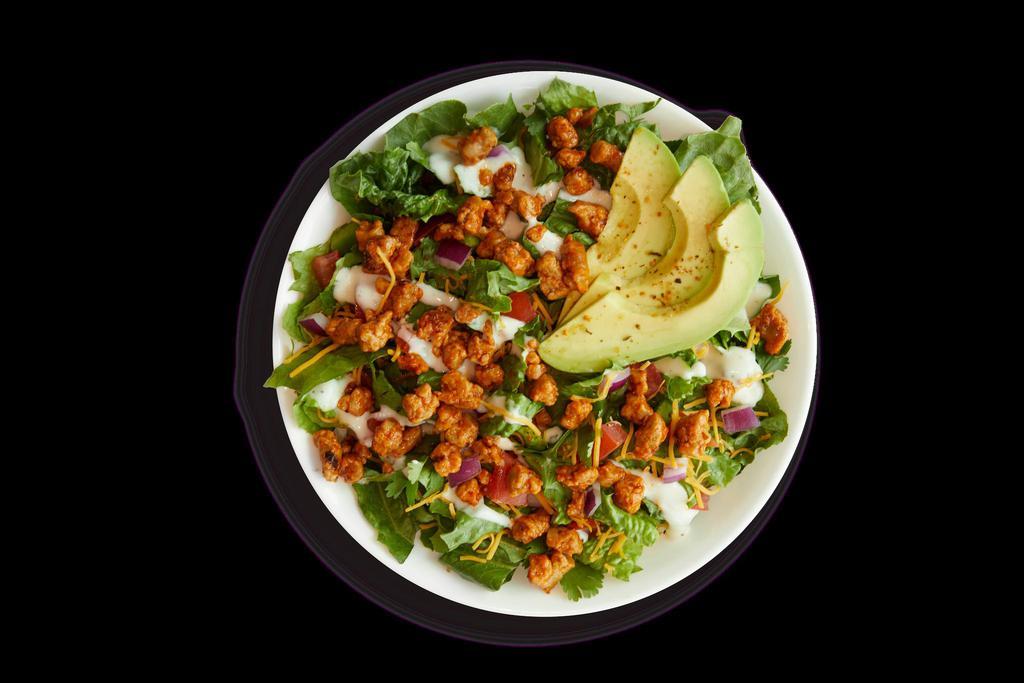 Beyond Buffalo Ranch · Beyond Beef Crumbles grilled in Buffalo Sauce, Avocado, Romaine, Tomatoes, Green Peppers, Onions, Cilantro, Cheddar, Mojito Lime Seasoning, Ranch Dressing
