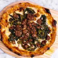 Salsiccia e Rapini Pizza · Provolone, fontina, fiordilatte broccoli rabe and sweet sausage.