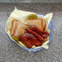 Link Basket · Come with 2 links, fries, buttered toast, pickles, peppers and ketchup.