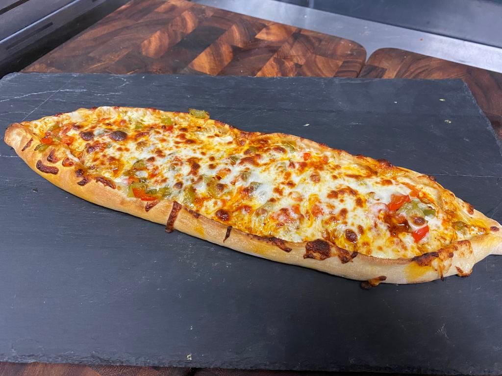 Spicy Chicken Cheese Pide  · Oven roasted chicken breast with spicy sauce, shredded mozzarella cheese and fresh peppers.