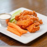 9 Wings ·  Tossed in Buffalo, BBQ or hot honey.