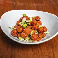 Popcorn Chicken · Asian veggie slaw, sesame-garlic toss, black and white sesame seeds.