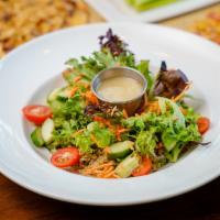 Quinoa Salad · Warm edamame-kale-quinoa blend, garden greens, tomatoes, carrots, cucumbers, and lemon vinai...