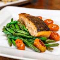 Salmon · 8 oz. pan seared fillet, lemon butter, blistered tomatoes, chefs fresh veggies, and edamame-...