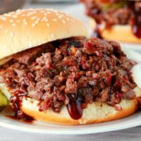 Chopped Beef Brisket Sandwich · Simple 12 hours smoked brisket to perfection and served with onions and pickles