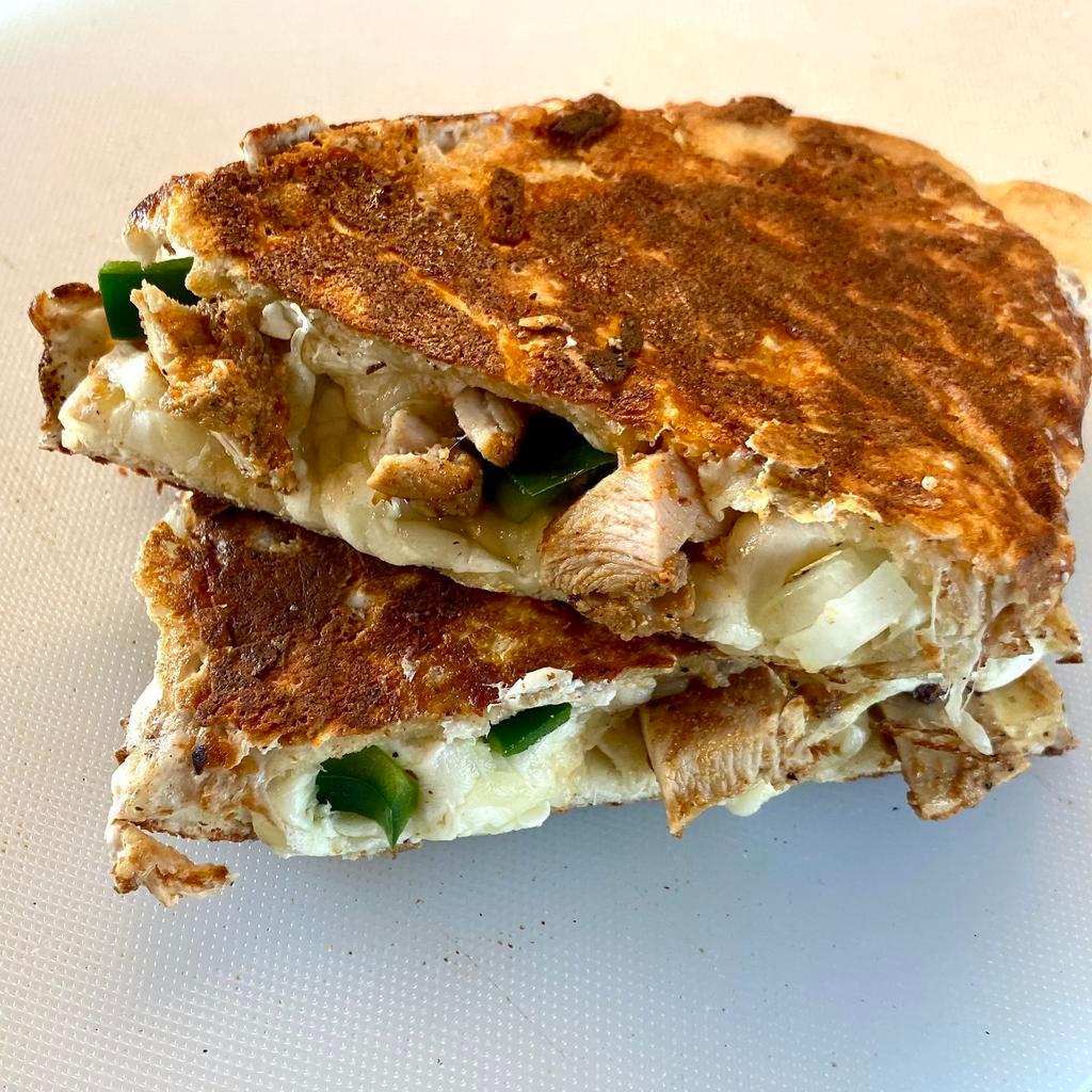 Chicken Quesadilla · A blend of oaxaca cheese, provolone and mozzarella, Mediterranean grilled chicken, grilled diced onions and poblano peppers inside 7