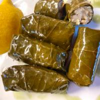 Stuffed Grape Leaves · Grape Leaves stuffed with rice, cooked in lemon and extra virgin olive oil. 5 large pieces.
