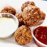 Falafel · 6 pieces. Comes with a side of tahini sauce and pita bread.