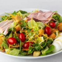 Celebrity Chef Salad · Hand-carved turkey breast, ham, Cheddar/Monterey Jack cheeses, tomato, hard-boiled egg, and ...