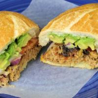 Milanesa de Pollo Torta · Served with beans, lettuce, tomato, onions, jalapeno, avocado, Oaxaca cheese and mayonnaise.