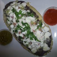 Cecina Huarache · Beans, lettuce, tomato, queso fresco, sour cream on a thick homemade tortilla.
