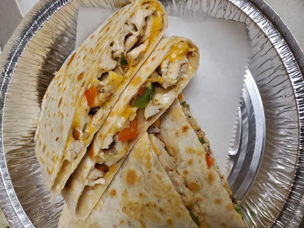 CRISPY Chicken Quesadilla · Grilled chicken, peppers, onions, mozzarella cheese and cheddar cheese. Served with guacamole, sour cream and salsa.