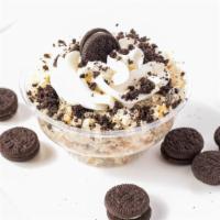 Oreo · Vanilla cake infused with crushed Oreos, topped with a Vanilla Buttercream, Oreo Crumbs and ...