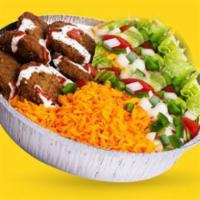 Falafel over Rice · Homemade falafel with onions and peppers.