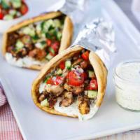 Chicken Gyro · Chopped chicken with onions, peppers and cilantro.