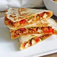 spicy chicken Quesadilla  ·  spicy chicken . green pepper , onion mozzarella cheese and cheddar cheese 