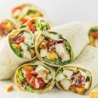 W2. Caesar Wrap · Grilled chicken, Parmesan cheese, lettuce, tomato and Caesar dressing.