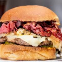 10. Reuben Burger · Hot pastrami, swiss cheese, sauerkraut, Russian dressing, and pickles on a deli bun.