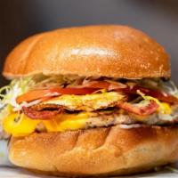 27. Turkey Royal Burger · Fresh ground turkey, fried egg, turkey bacon, American cheese, lettuce, tomato, and mayo on ...