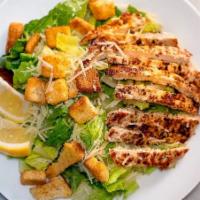 Chicken Caesar Salad · Fresh romaine lettuce, grated Parmesan cheese, seasoned croutons, and fresh grilled chicken.