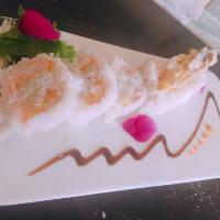 Coconut Shrimp Roll · shirmp tempura cucumber mango wrap with pink soypaper top with coconut flake and  chef speic...