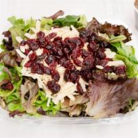 A4. Mesclun Salad with Goat Cheese · Mesclun leaves, goat cheese, caramelized walnuts and dried cranberries.