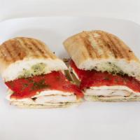 B19. Grilled Chicken Pesto Sandwich · Grilled chicken, fresh mozzarella, roasted peppers and homemade basil pesto.
