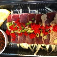 Tuna Tataki · Thin slice of seared tuna with scallion, tobiko and ponzu sauce.
