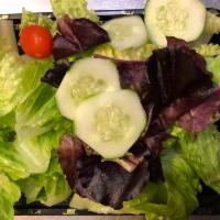 Mixed Green Salad · Fresh salad with a variety of green vegetables typically served on a bed of lettuce. 