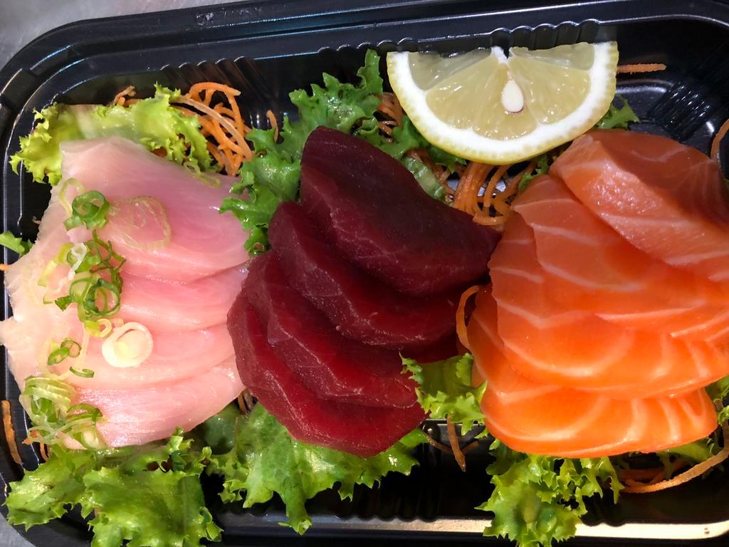 Tri-Color Sashimi · 4 pieces of tuna, 4 pieces of salmon and 4 pieces of yellowtail.