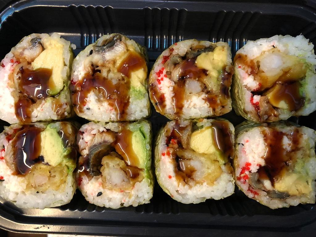 Yuri Roll · Shrimp tempura, snow crab, eel, avocado and tobiko in soybean paper with eel sauce.