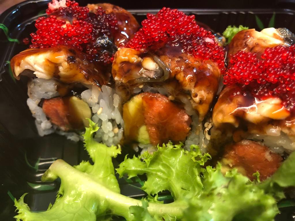 Dancing Eel Roll · Spicy tuna, avocado and crunch topped with eel, tobiko and eel sauce.