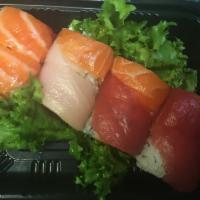 Samurai Roll · Spicy tuna, crunch and avocado inside with tuna, salmon and yellowtail on top.