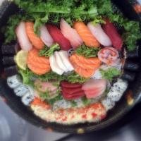 Sushi and Sashimi Party Tray 2 · 4 pieces of tuna sashimi, 9 pieces of salmon sashimi, 3 pieces of yellowtail sashimi, 3 piec...